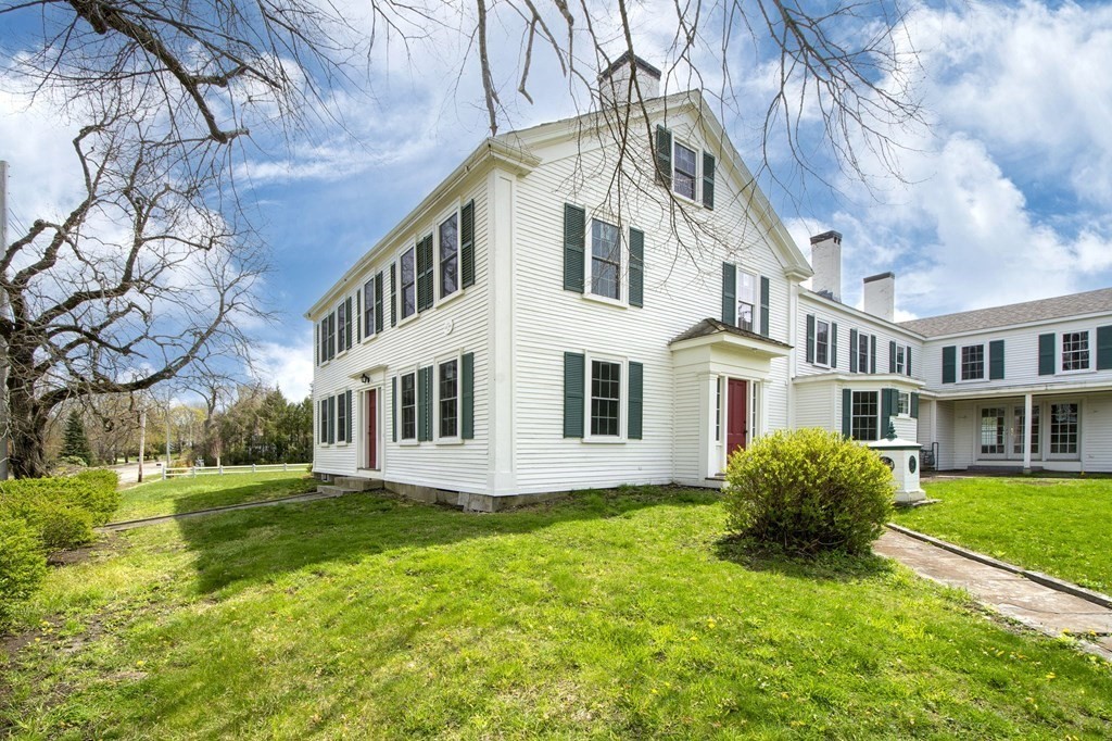 128 Washington Street, Unit F Hanover, MA 02339 - Photo 2 of 42 a view of a house with a yard