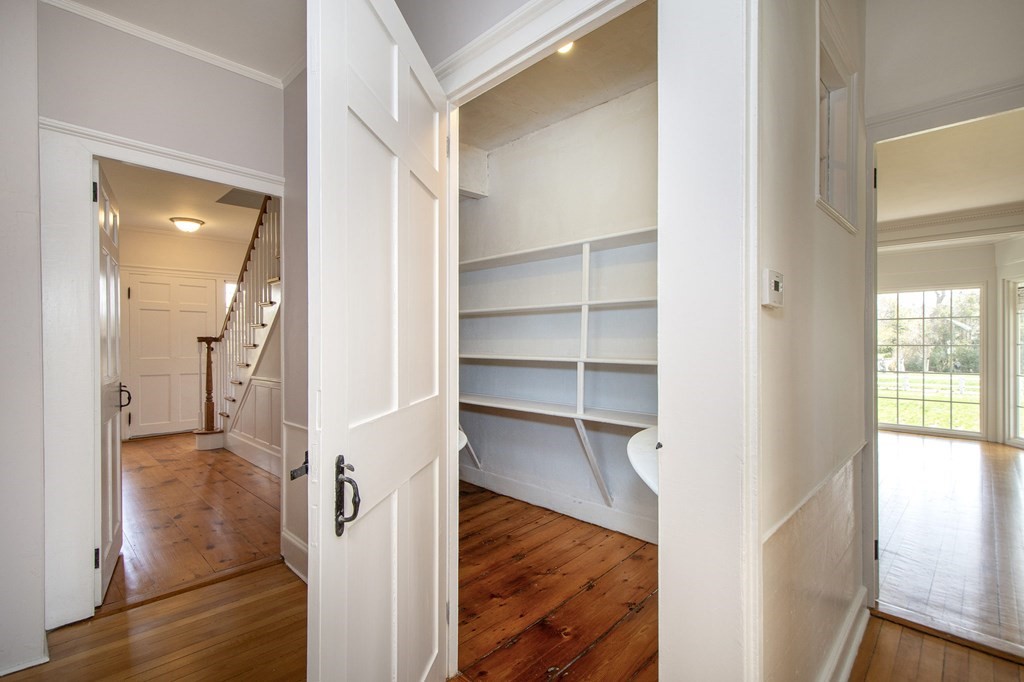 128 Washington Street, Unit F Hanover, MA 02339 - Photo 24 of 42 a view of a hallway with wooden floor and entryway