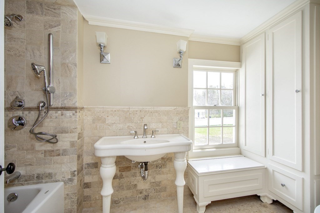 128 Washington Street, Unit F Hanover, MA 02339 - Photo 39 of 42 a bathroom with a sink and a bathtub
