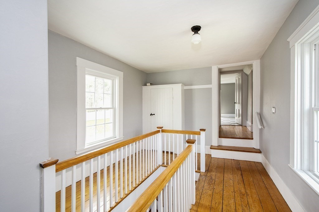 128 Washington Street, Unit F Hanover, MA 02339 - Photo 40 of 42 a view of an entryway with wooden floor and windows