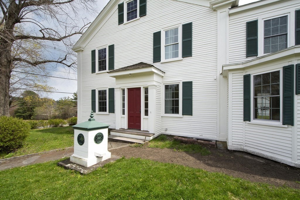 128 Washington Street, Unit F Hanover, MA 02339 - Photo 5 of 42 a white bench sitting in front of a house
