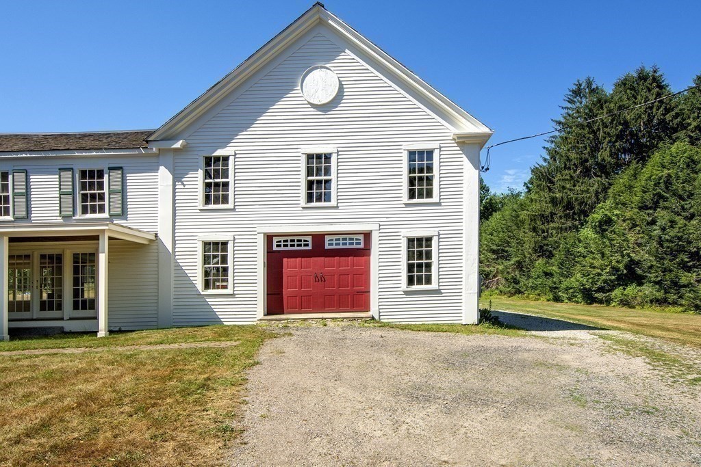 128 Washington Street, Unit F Hanover, MA 02339 - Photo 6 of 42 a front view of a house with a yard