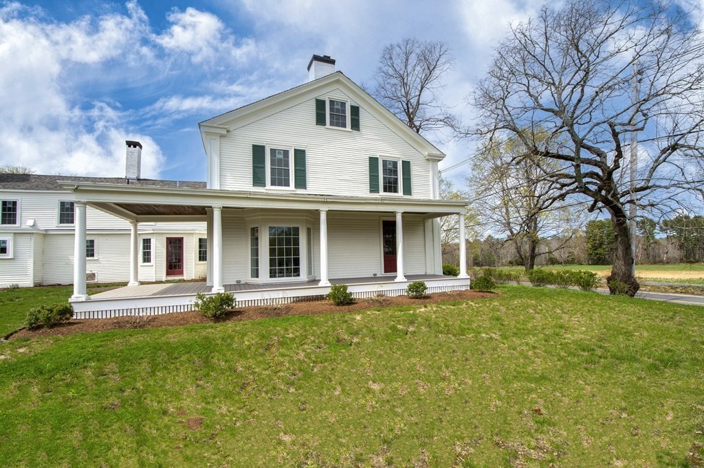 128 Washington Street, Unit F Hanover, MA 02339 - Photo 8 of 42 a front view of a house with a yard