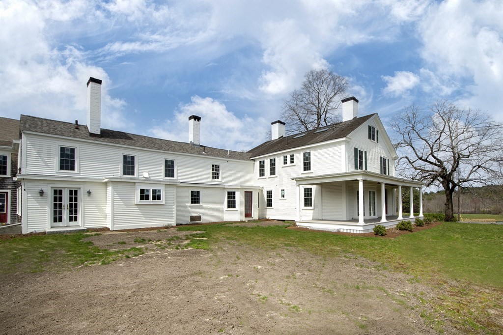 128 Washington Street, Unit F Hanover, MA 02339 - Photo 10 of 42 a front view of a house with a yard