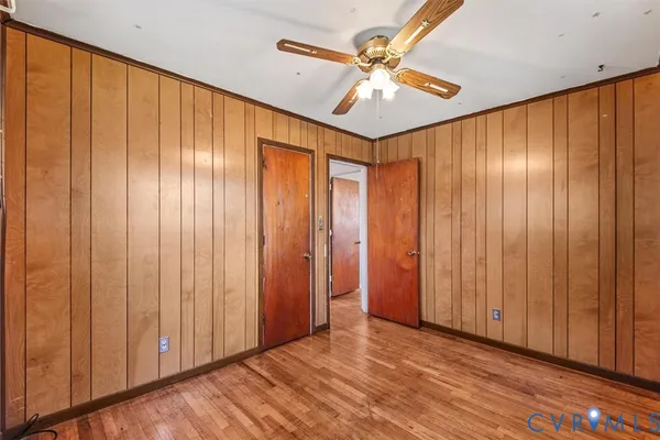 a view of an empty room and wooden floor
