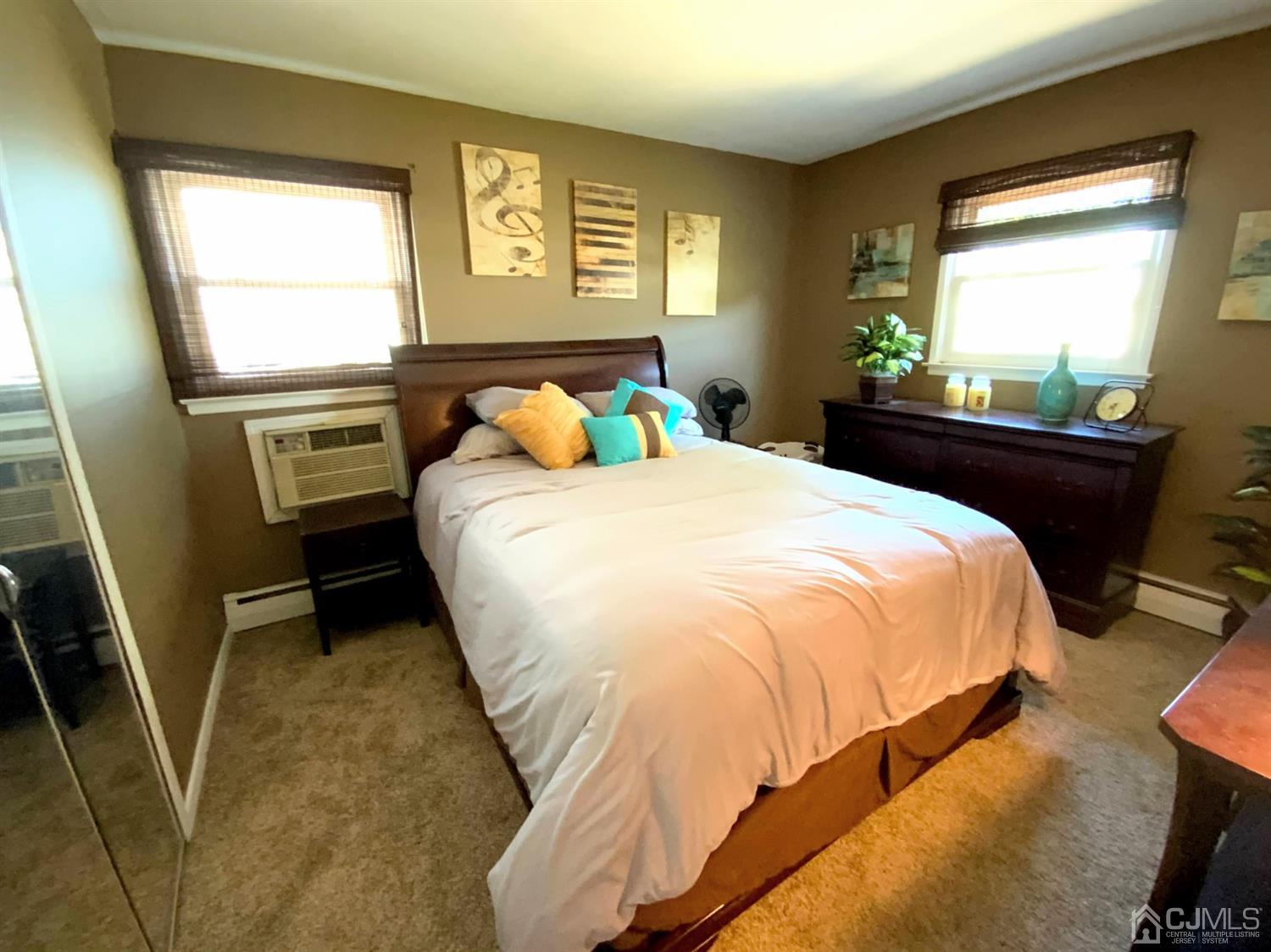 56 Farmingdale Road Fords, NJ 08863 - Photo 11 of 18 a bed sitting in a bedroom next to a window