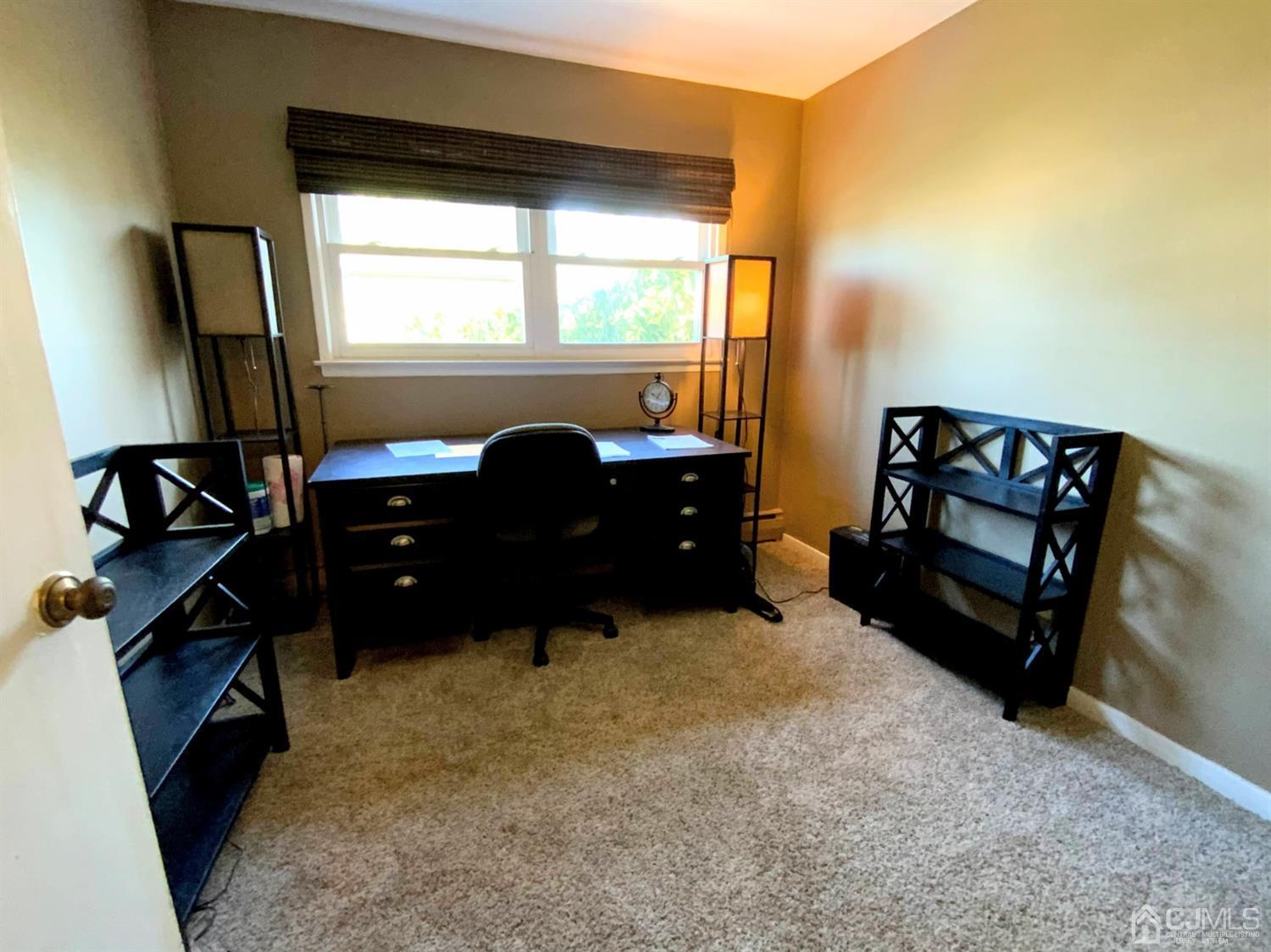 56 Farmingdale Road Fords, NJ 08863 - Photo 12 of 18 a living room with furniture window and dresser
