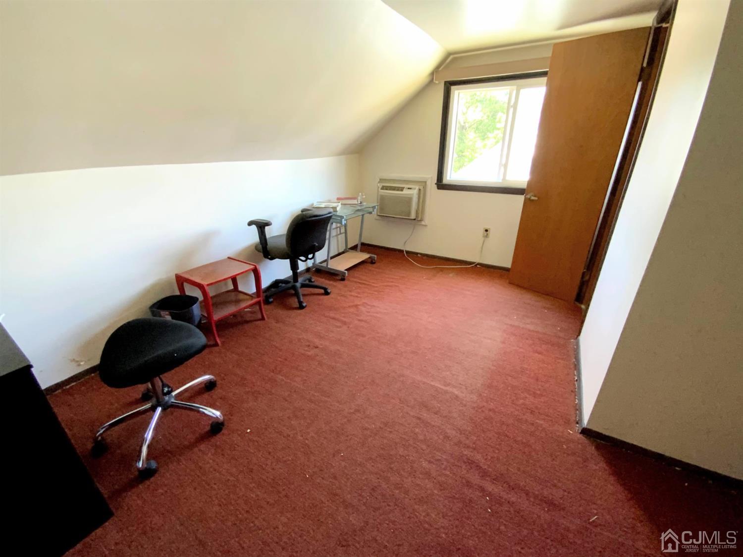 56 Farmingdale Road Fords, NJ 08863 - Photo 15 of 18 a living room with furniture and a window