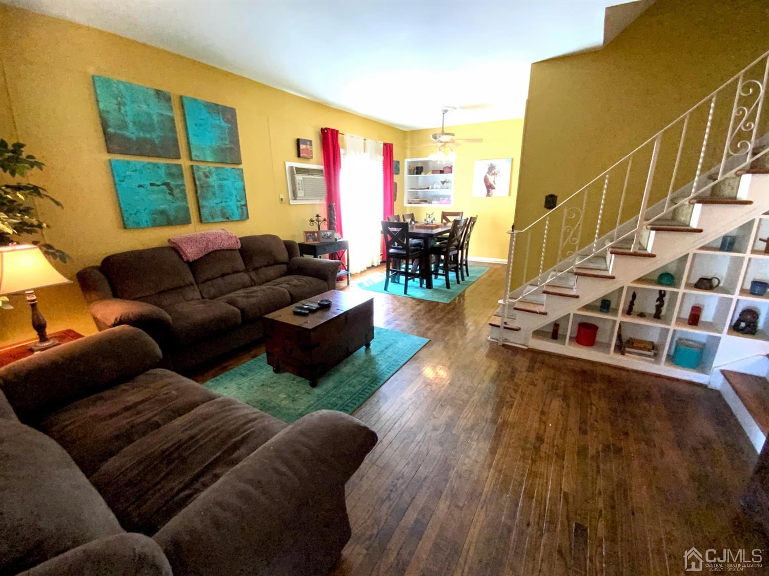 56 Farmingdale Road Fords, NJ 08863 - Photo 3 of 18 a living room with furniture and a floor to ceiling window