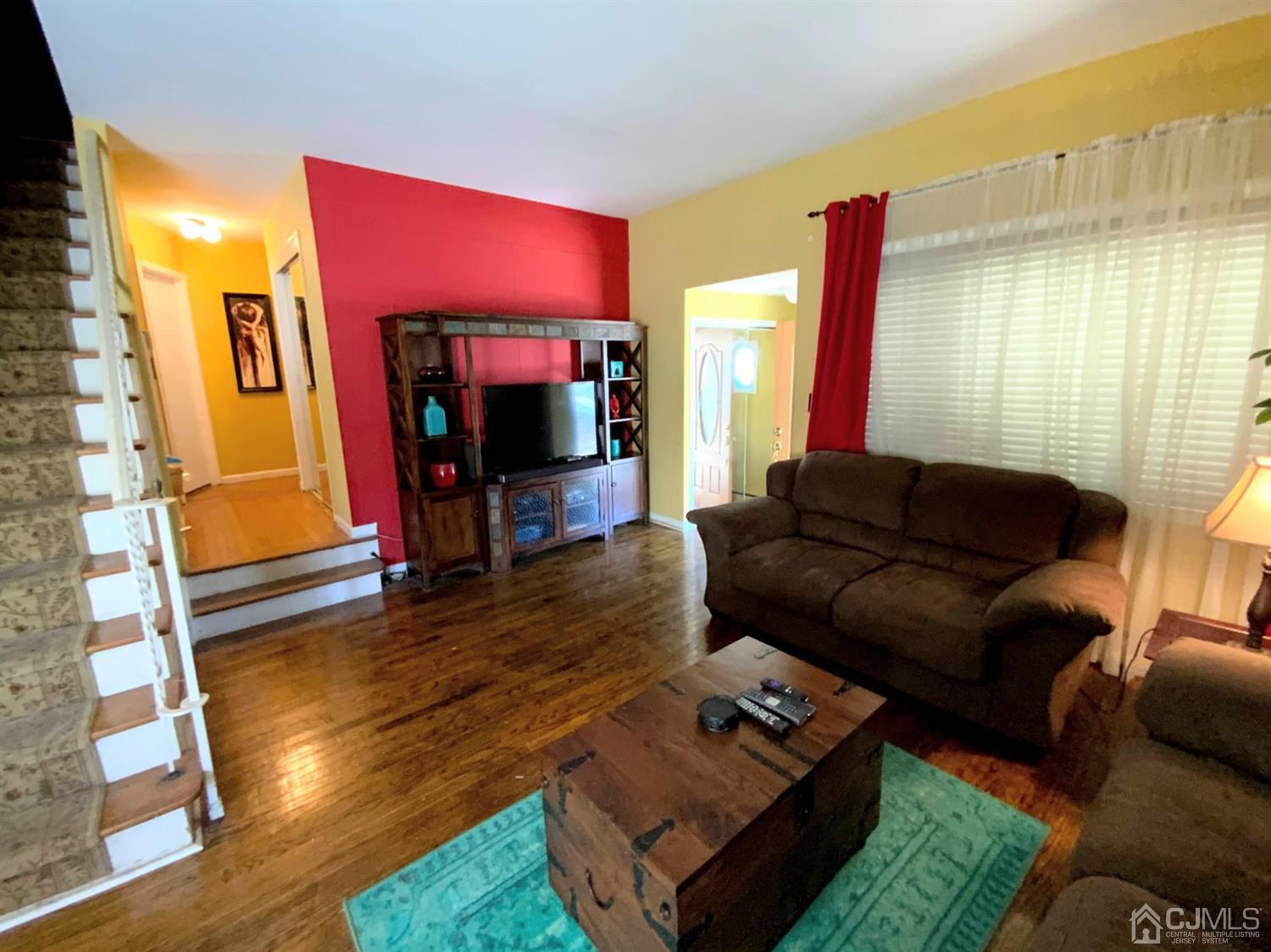 56 Farmingdale Road Fords, NJ 08863 - Photo 5 of 18 a living room with furniture and a fireplace
