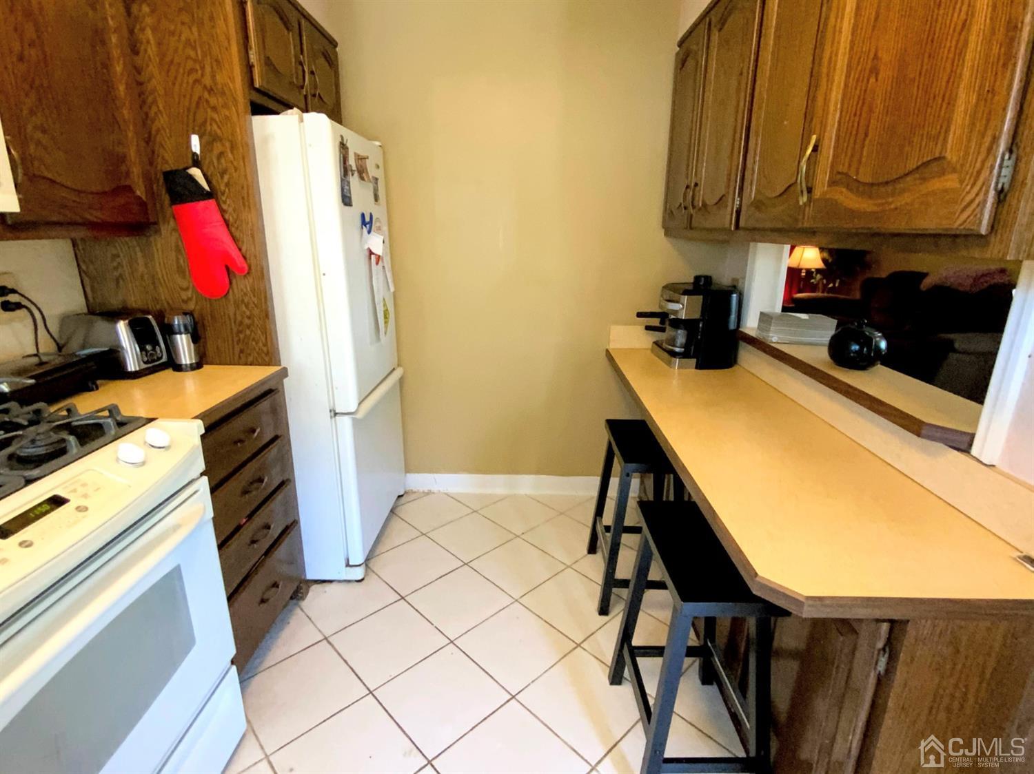 56 Farmingdale Road Fords, NJ 08863 - Photo 8 of 18 a view of a kitchen with appliances and cabinets