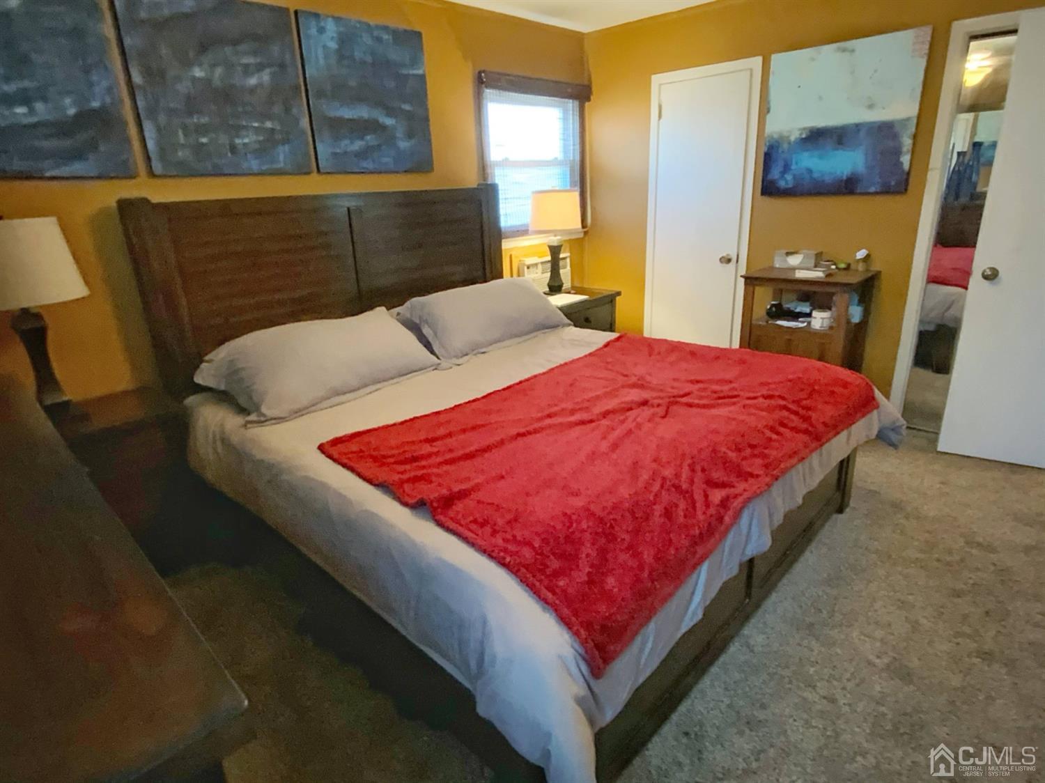 56 Farmingdale Road Fords, NJ 08863 - Photo 10 of 18 a bed sitting in a bedroom and a mirror