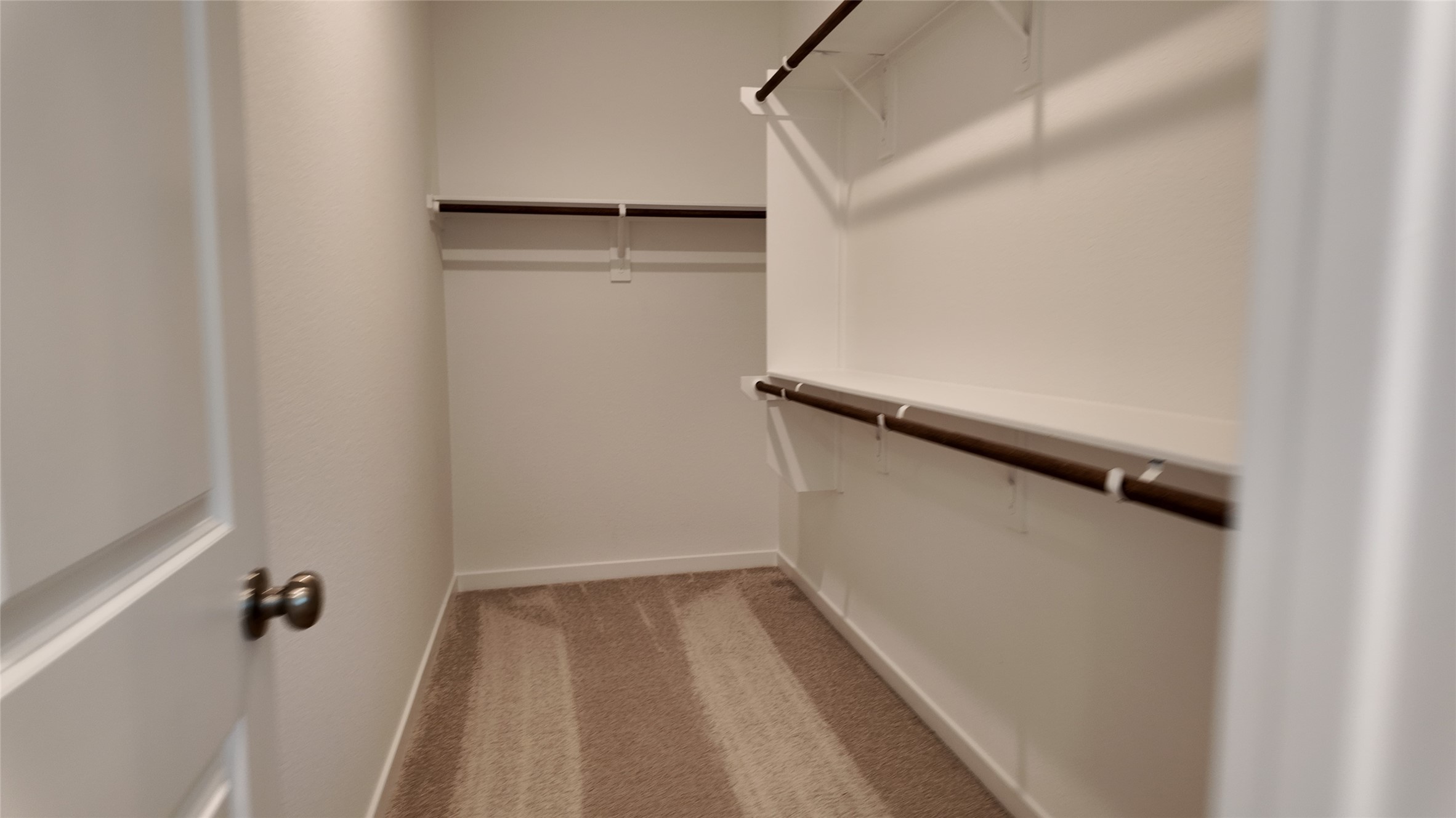 15645 Wandering Maple Way Conroe, TX 77302 - Photo 12 of 14 a view of a walk in closet