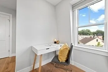 a bed room with a bed and a window