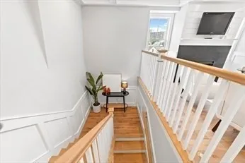 a view of a hallway with seating area