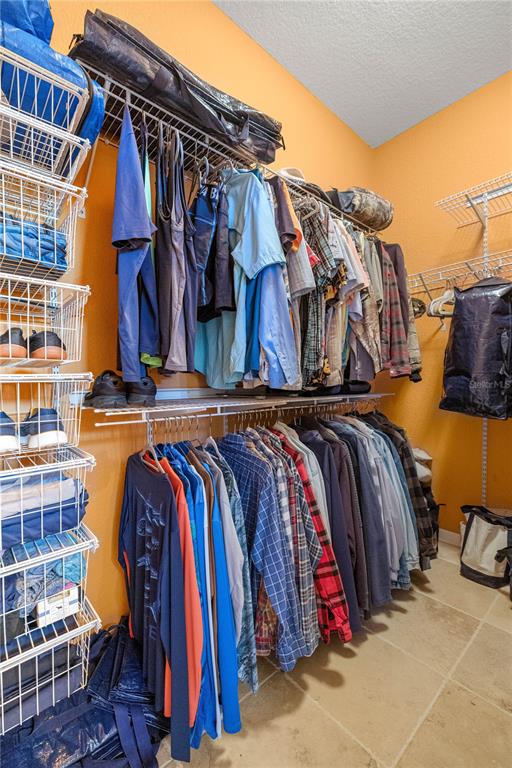 3817 North Calusa Point Crystal River, FL 34428 - Photo 18 of 54 a view of walk in closet with clothes and shoes