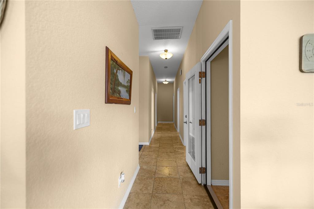 3817 North Calusa Point Crystal River, FL 34428 - Photo 19 of 54 a view of a hallway with wooden floor
