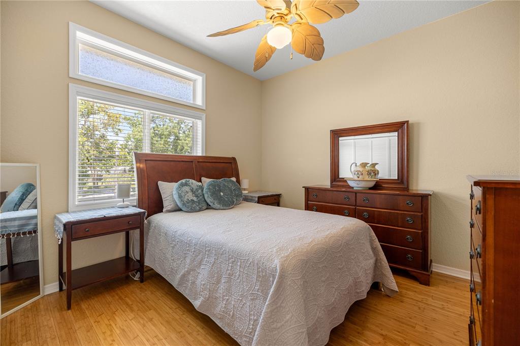 3817 North Calusa Point Crystal River, FL 34428 - Photo 20 of 54 a bedroom with a bed and a chandelier
