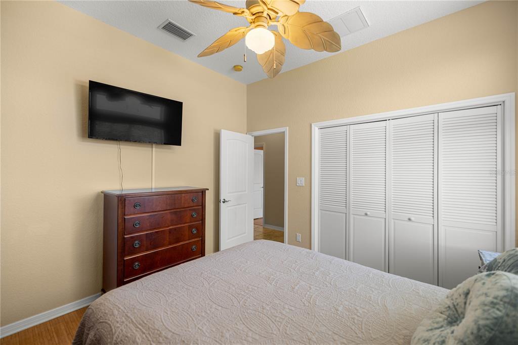3817 North Calusa Point Crystal River, FL 34428 - Photo 21 of 54 a bedroom with a bed and a flat screen tv