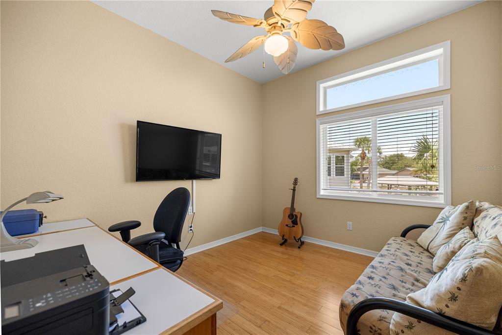 3817 North Calusa Point Crystal River, FL 34428 - Photo 25 of 54 a living room with furniture and a flat screen tv