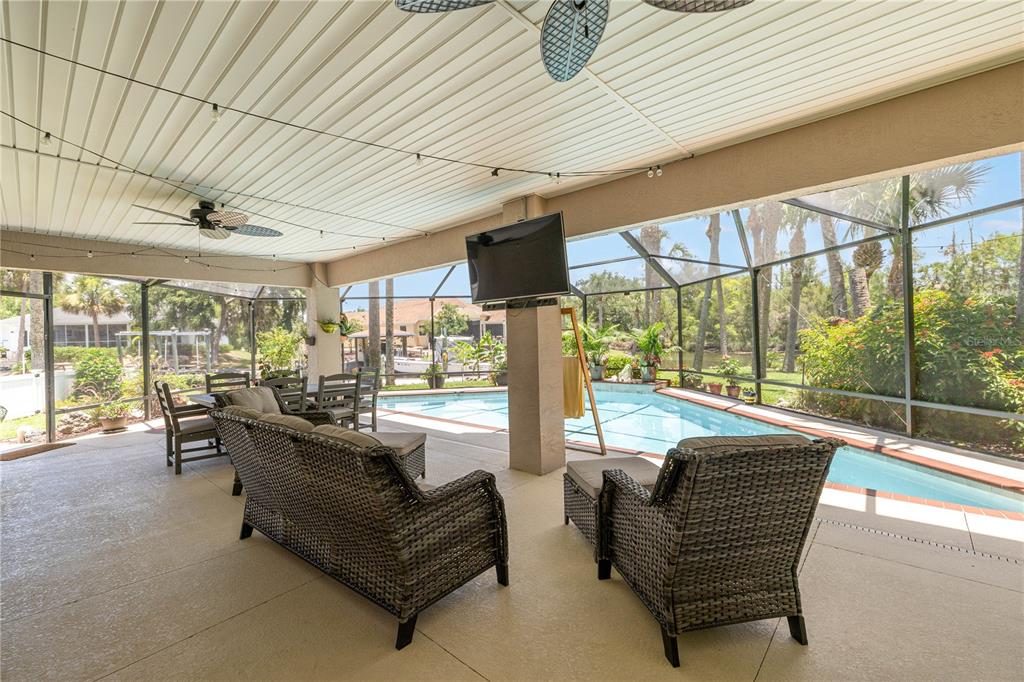 3817 North Calusa Point Crystal River, FL 34428 - Photo 32 of 54 a living room with furniture and a floor to ceiling window