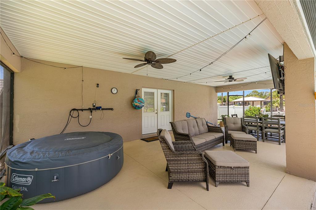 3817 North Calusa Point Crystal River, FL 34428 - Photo 35 of 54 a living room with furniture and a chandelier