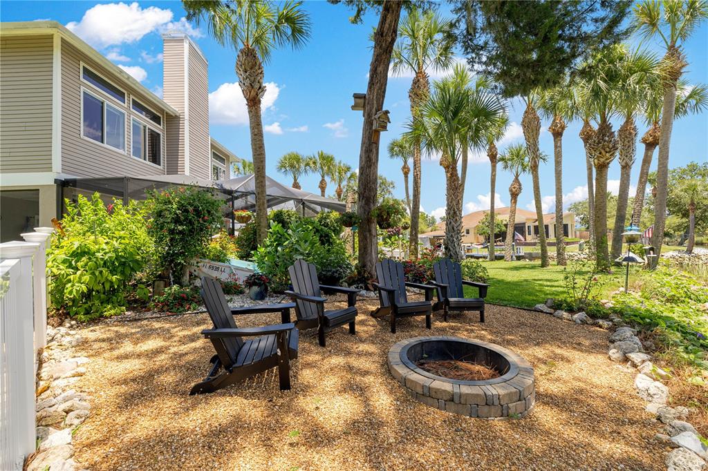 3817 North Calusa Point Crystal River, FL 34428 - Photo 38 of 54 a backyard of a house with fountain table and chairs