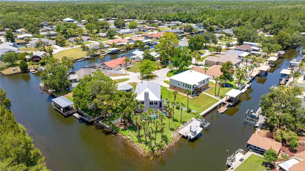 3817 North Calusa Point Crystal River, FL 34428 - Photo 4 of 54 an aerial view of residential houses with outdoor space and lake view