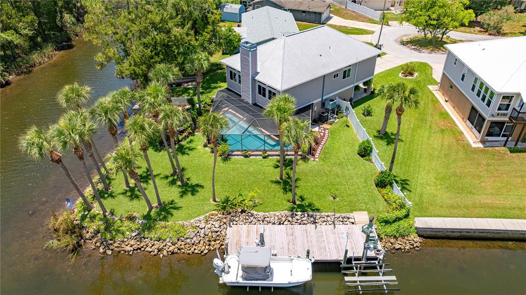3817 North Calusa Point Crystal River, FL 34428 - Photo 5 of 54 an aerial view of a house with a garden and lake view