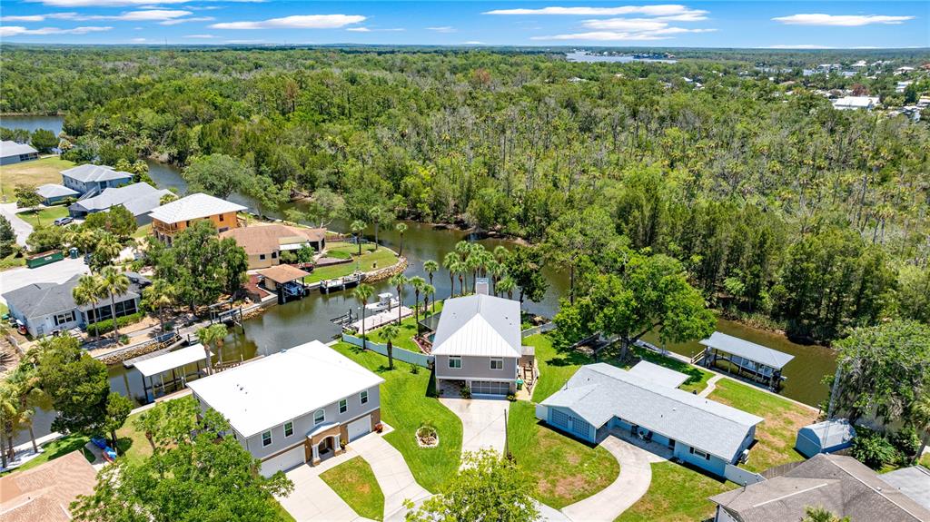 3817 North Calusa Point Crystal River, FL 34428 - Photo 51 of 54 an aerial view of a house with a yard basket ball court and outdoor seating