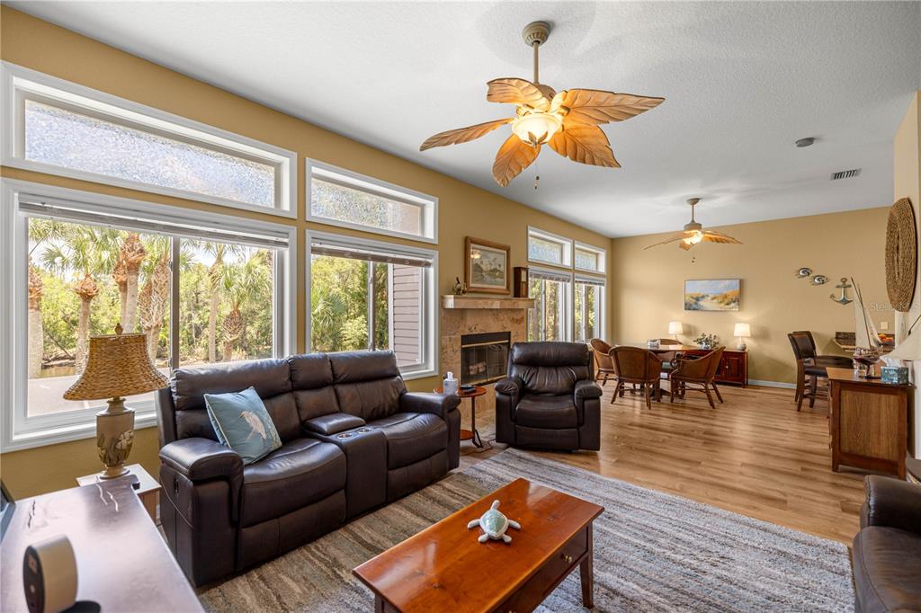 3817 North Calusa Point Crystal River, FL 34428 - Photo 7 of 54 a living room with furniture a dining table and a large window