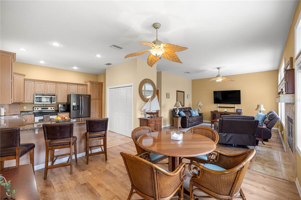 3817 North Calusa Point Crystal River, FL 34428 - Photo 10 of 54 a view of a dining room with furniture window and wooden floor