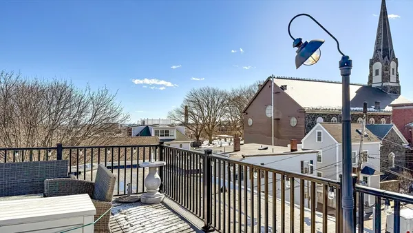 a view of a balcony and yard