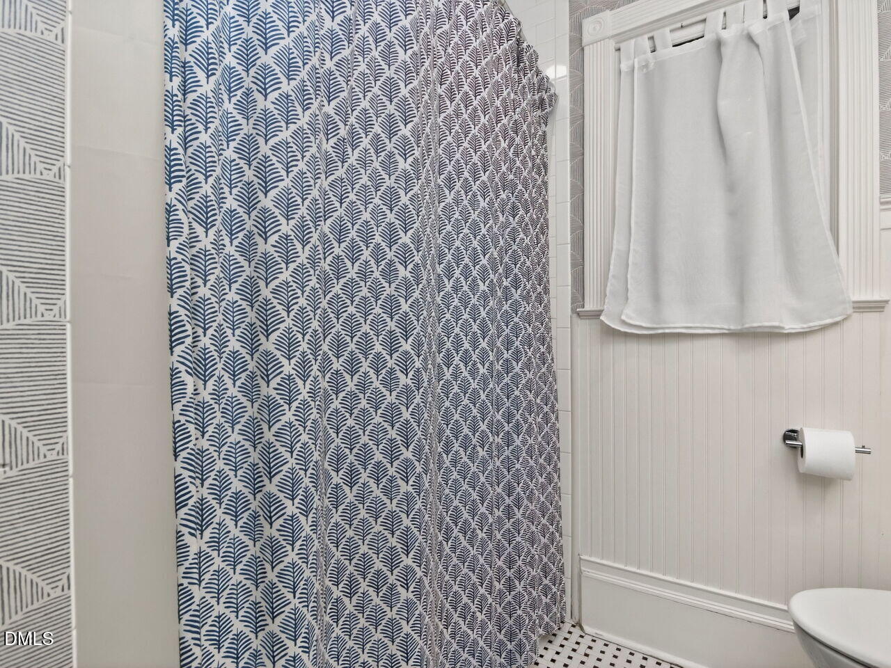 6004 Tarnhour Court Raleigh, NC 27612 - Photo 25 of 44 a bathroom with a shower curtain and a sink
