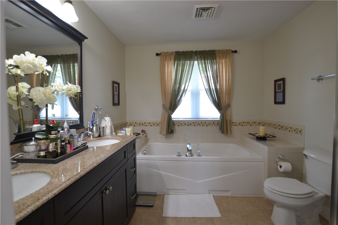 517 Pleasant Street Pawtucket, RI 02860 - Photo 15 of 24 Jetted tub, shower and double sinks