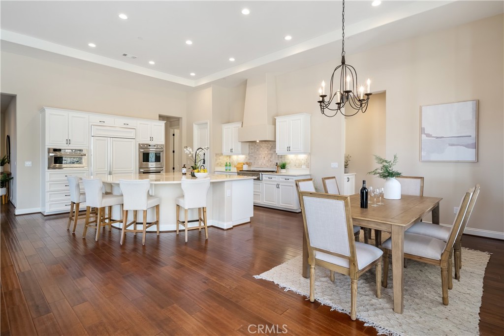 1541 Mesa Road Nipomo, CA 93444 - Photo 27 of 70 a dining room with kitchen island stainless steel appliances furniture a dining table and chairs