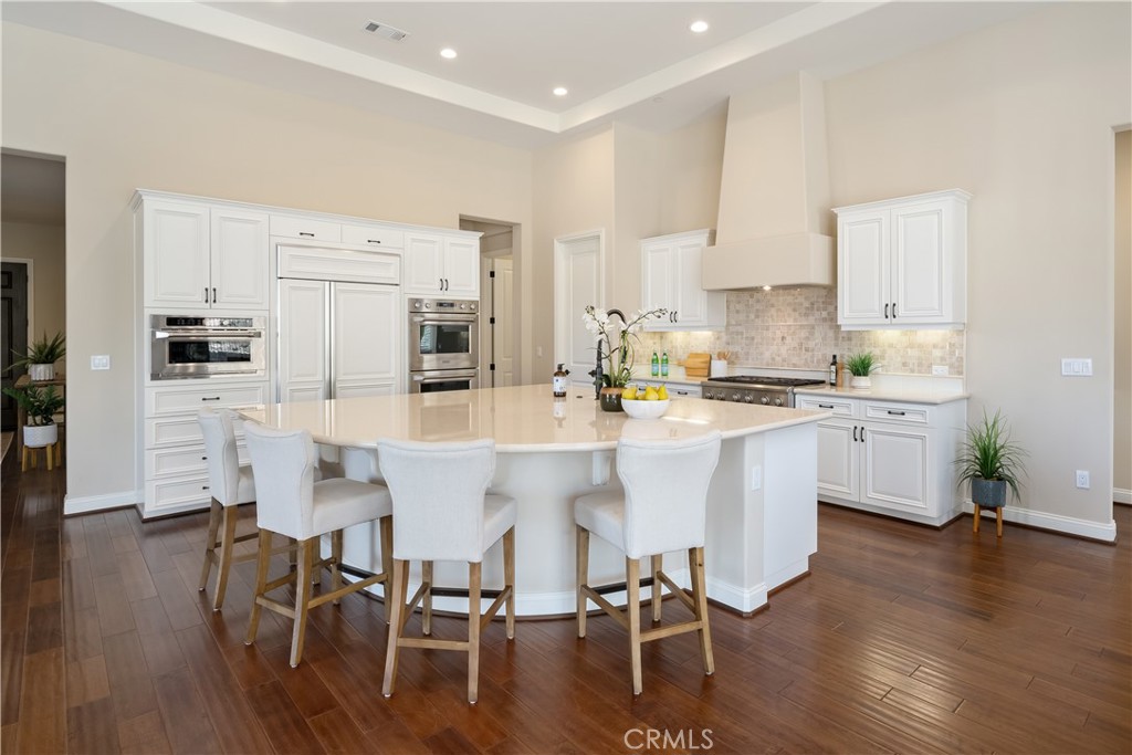 1541 Mesa Road Nipomo, CA 93444 - Photo 28 of 70 a kitchen with stainless steel appliances a table chairs refrigerator sink and cabinets