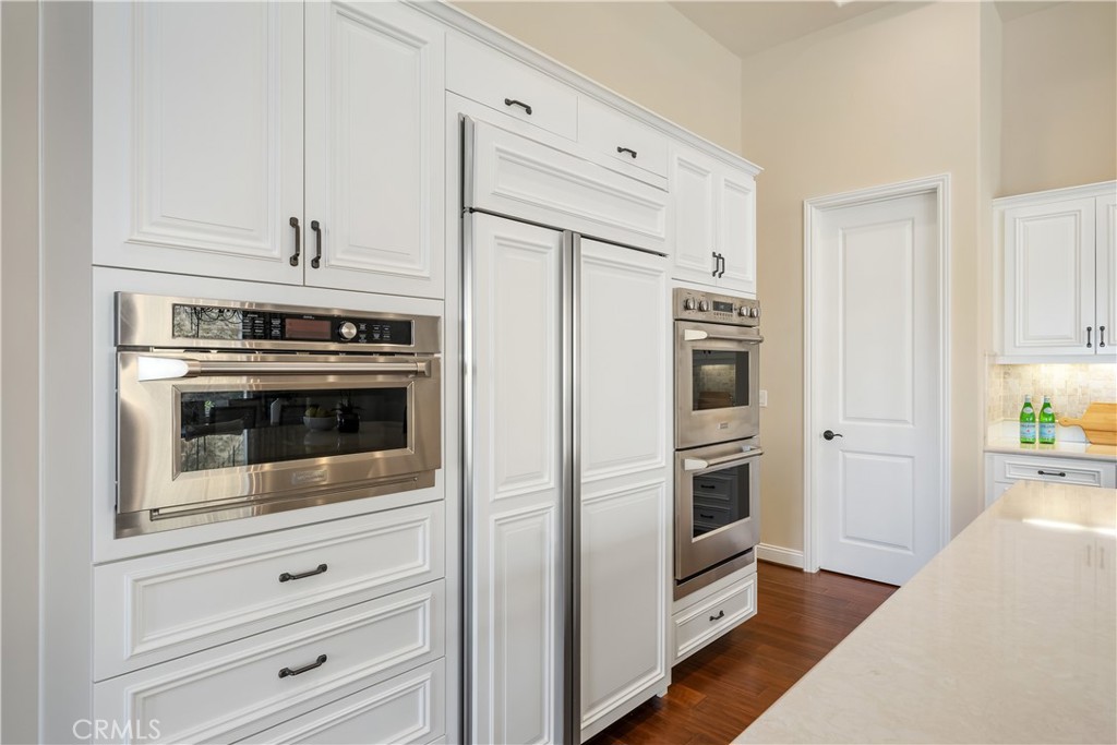 1541 Mesa Road Nipomo, CA 93444 - Photo 30 of 70 a kitchen with stainless steel appliances white cabinets and a refrigerator