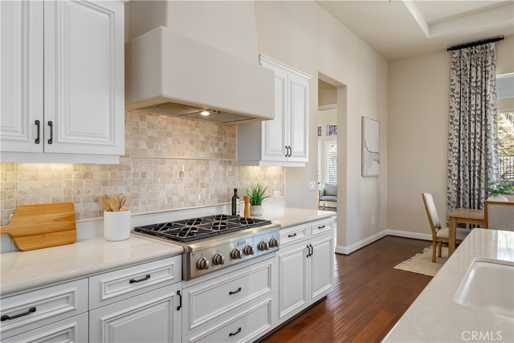 1541 Mesa Road Nipomo, CA 93444 - Photo 32 of 70 a kitchen with granite countertop a stove and white cabinets