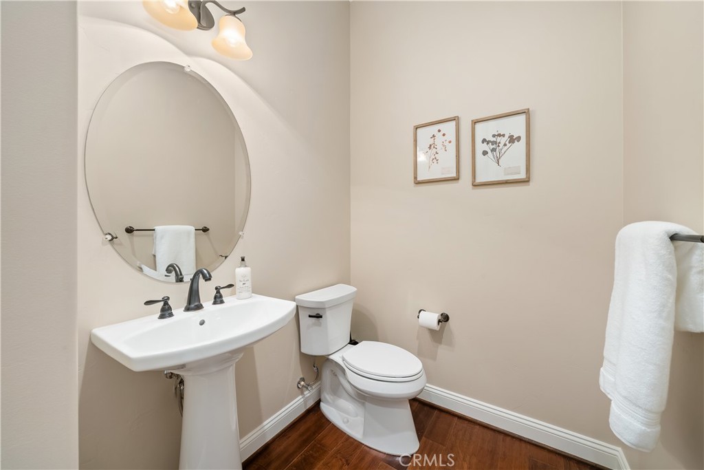 1541 Mesa Road Nipomo, CA 93444 - Photo 54 of 70 a white toilet sitting next to a bathroom sink
