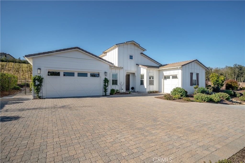 1541 Mesa Road Nipomo, CA 93444 - Photo 61 of 70 a front view of a house with a yard and garage