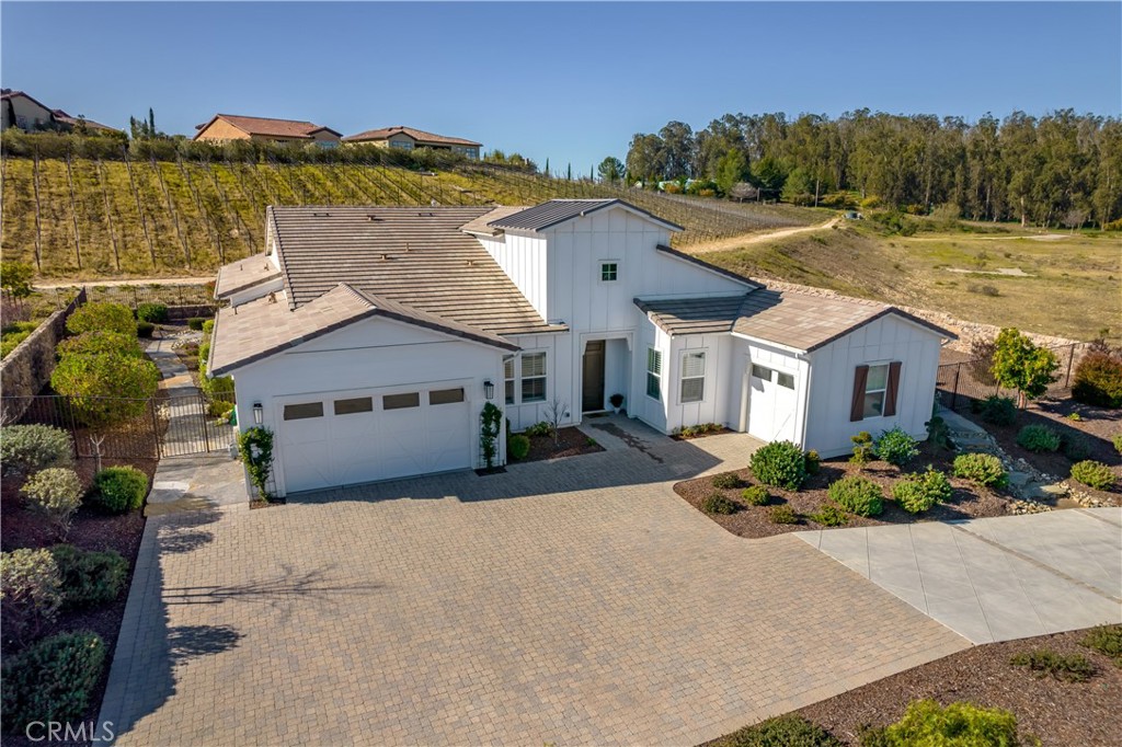 1541 Mesa Road Nipomo, CA 93444 - Photo 62 of 70 a front view of a house with a yard and outdoor seating