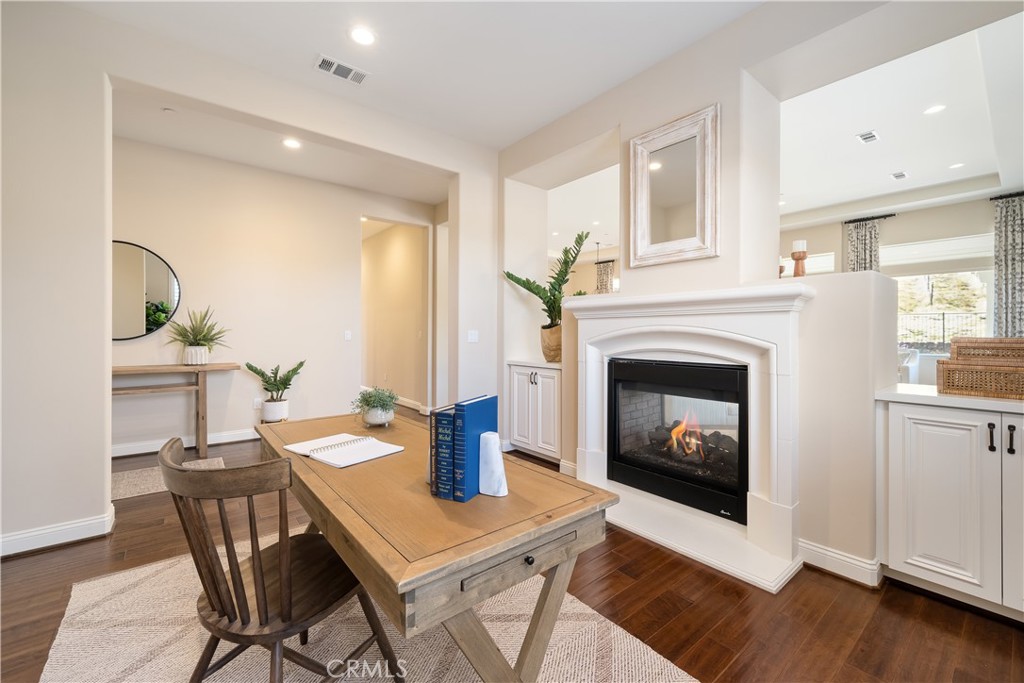 1541 Mesa Road Nipomo, CA 93444 - Photo 7 of 70 a living room with a fireplace a dining table and a window