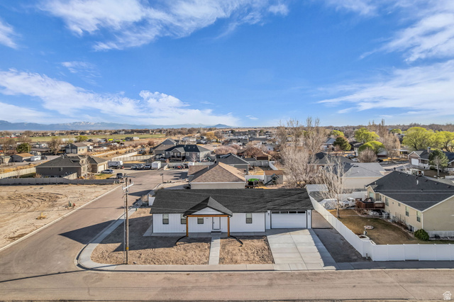 520 East 450th Street North Delta, UT 84624 - Photo 37 of 48 Aerial perspective of suburban area featuring a mountain backdrop
