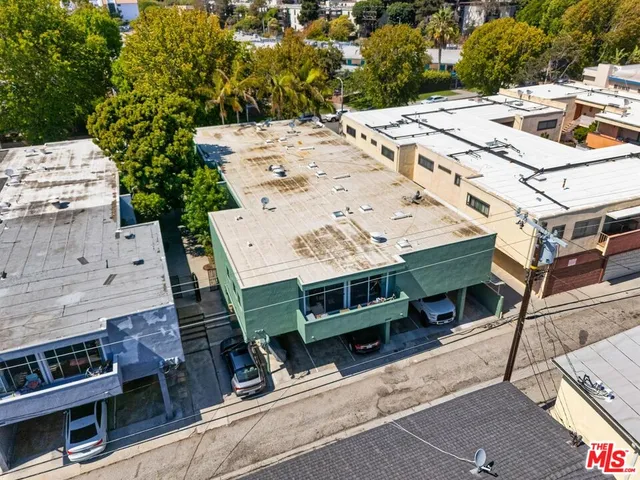 a view of a patio with a table and chairs