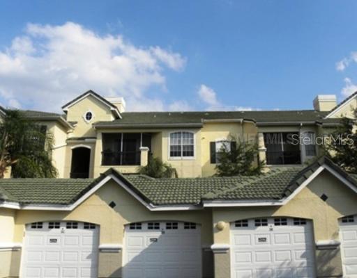 5134 Northridge Road, Unit 211 Sarasota, FL 34238 - Photo 1 of 1 a front view of a house with a yard