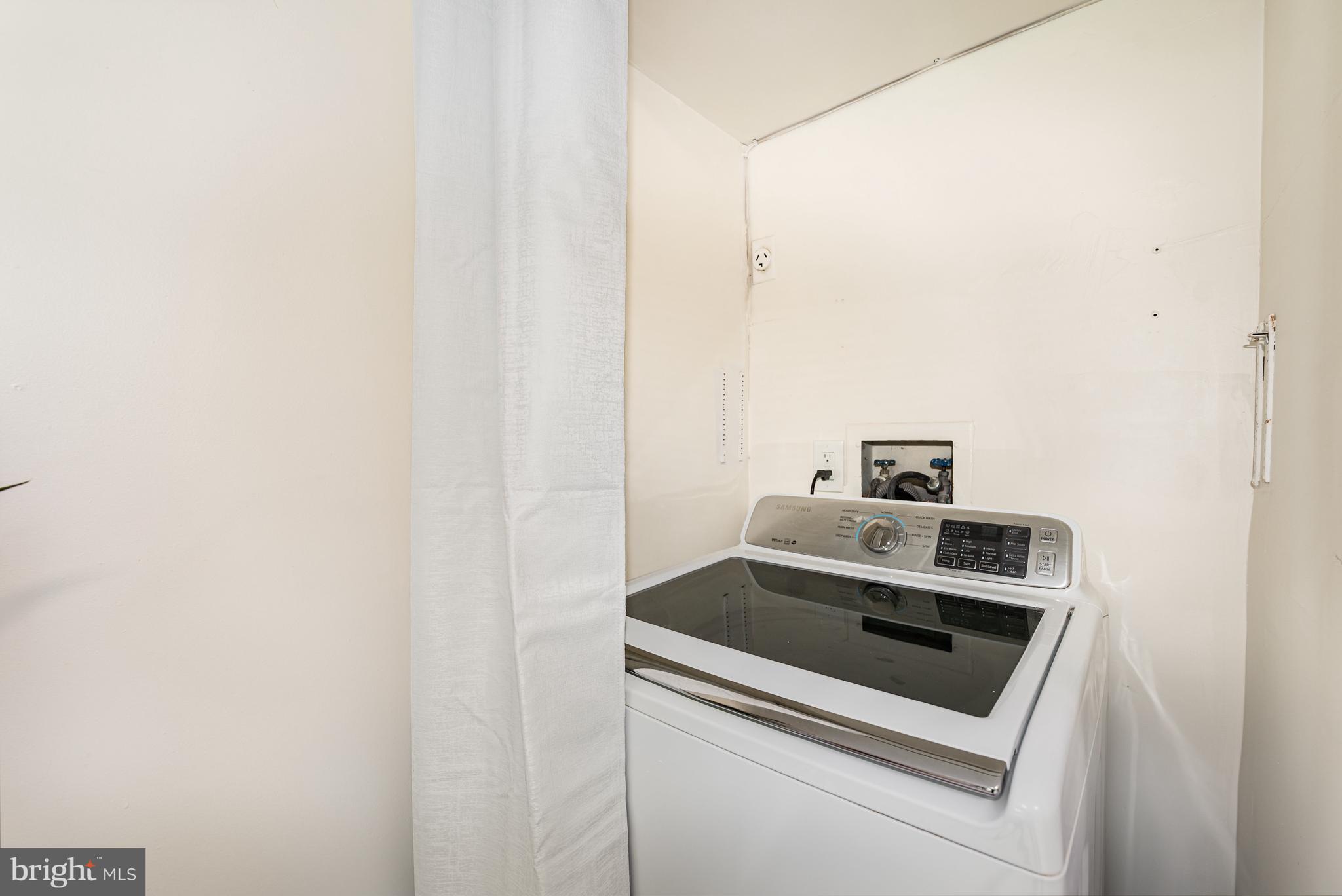 4219 Slater Avenue Nottingham, MD 21236 - Photo 12 of 25 a utility room with dryer and washer