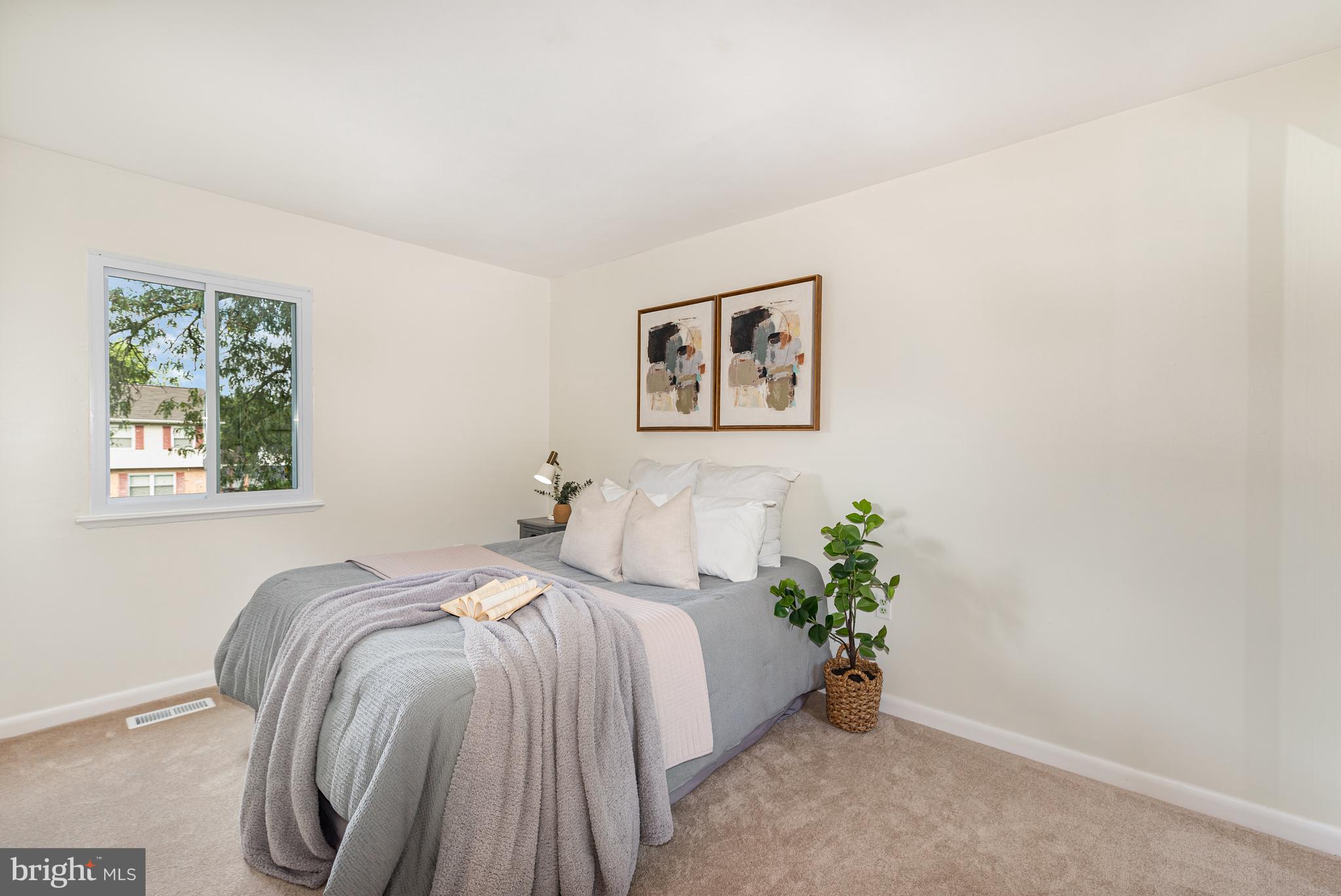 4219 Slater Avenue Nottingham, MD 21236 - Photo 17 of 25 a bed room with a bed and a painting