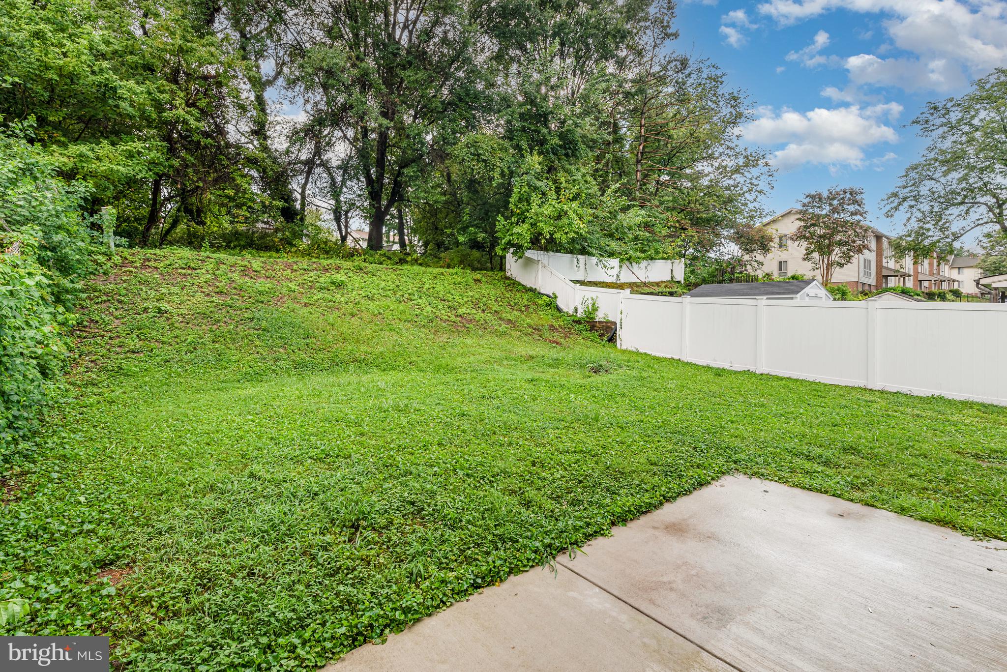 4219 Slater Avenue Nottingham, MD 21236 - Photo 22 of 25 a view of a garden with a bench