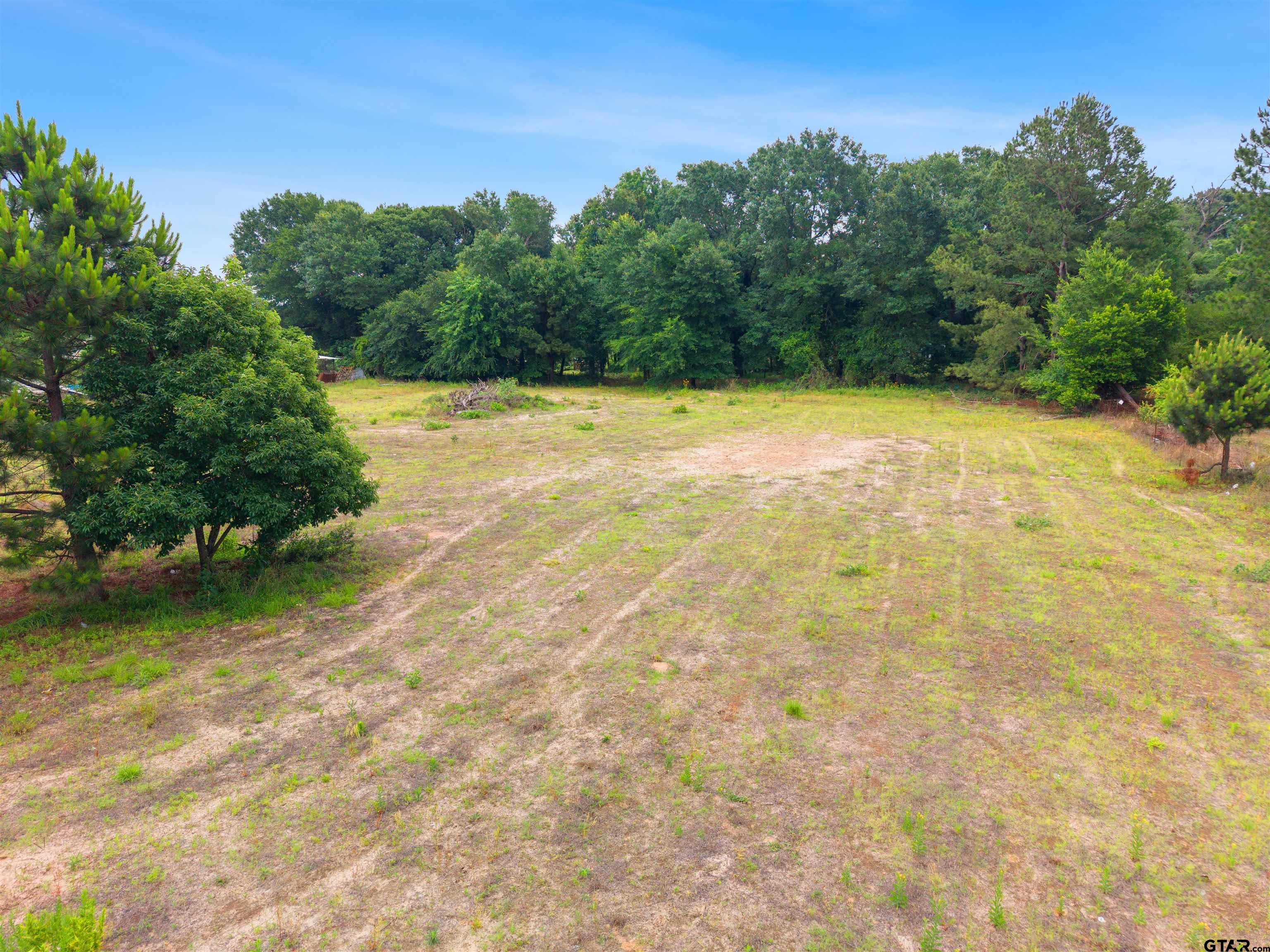 2425 Thompson Lane Tyler, TX 75704 - Photo 2 of 27 a view of a yard with swimming pool